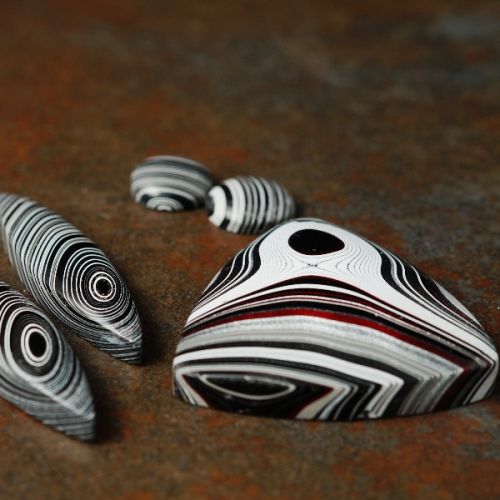 A selection of Geometric Fordite Cabochons used in the creation of limited edittion Joolzery jewellery